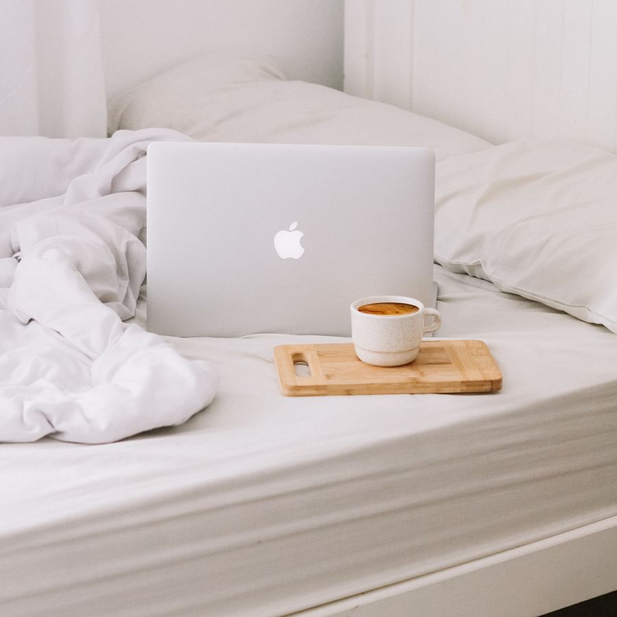 Busy professional managing schedules on multiple devices